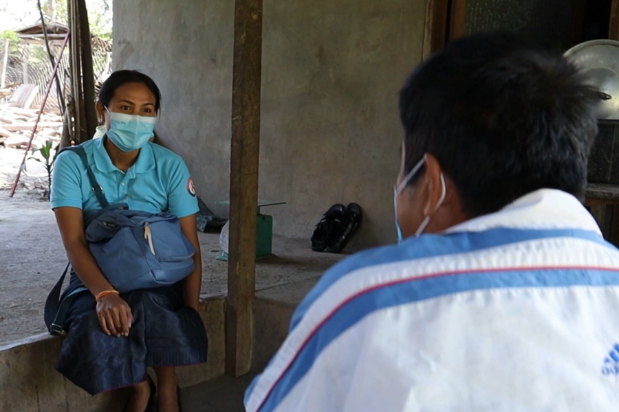 Daovone Outhaivong delivered ARVs to a patient living in the outskirt of Luang Prabang town Photo | UNAIDS Lao PDR