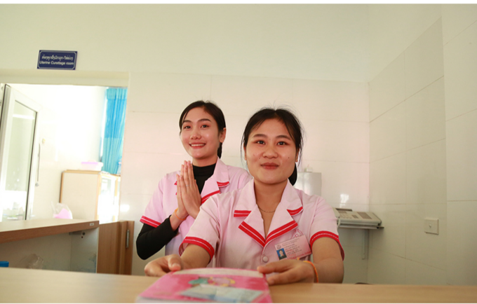 Midwifery students Aspy Kamsing (right) and Panin Chanthavong (left) work as interns at the Xieng Khouang central hospital while