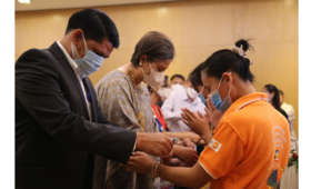 Photo 1: Nang Noi girls during Baci receiving blessings from UNFPA, Crowne Plaza and MoES. Photo by: Benyahia/UNFPA Laos.