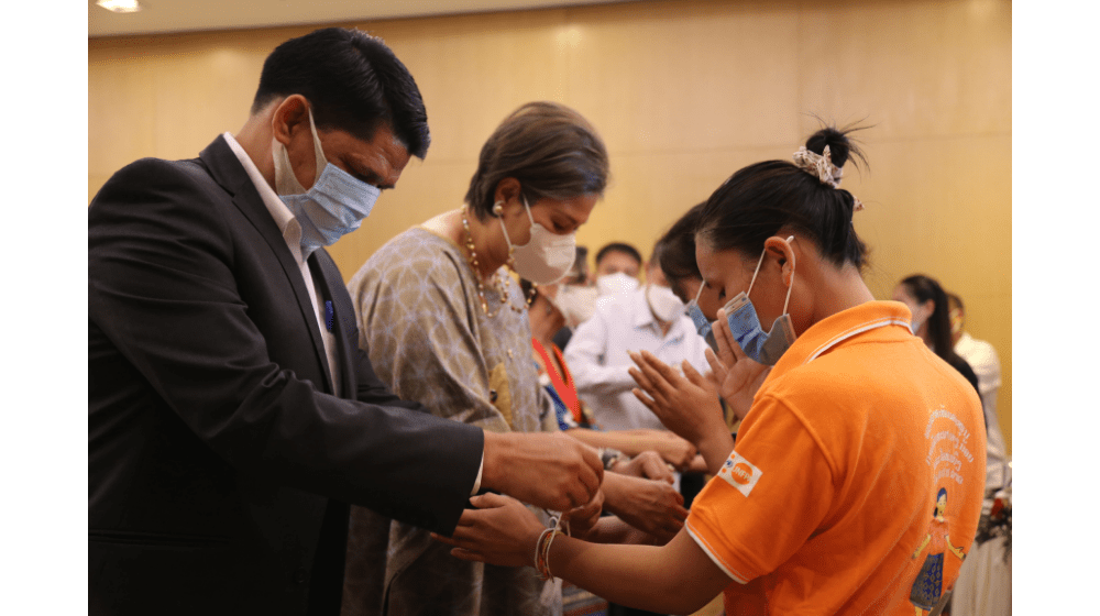 Photo 1: Nang Noi girls during Baci receiving blessings from UNFPA, Crowne Plaza and MoES. Photo by: Benyahia/UNFPA Laos.