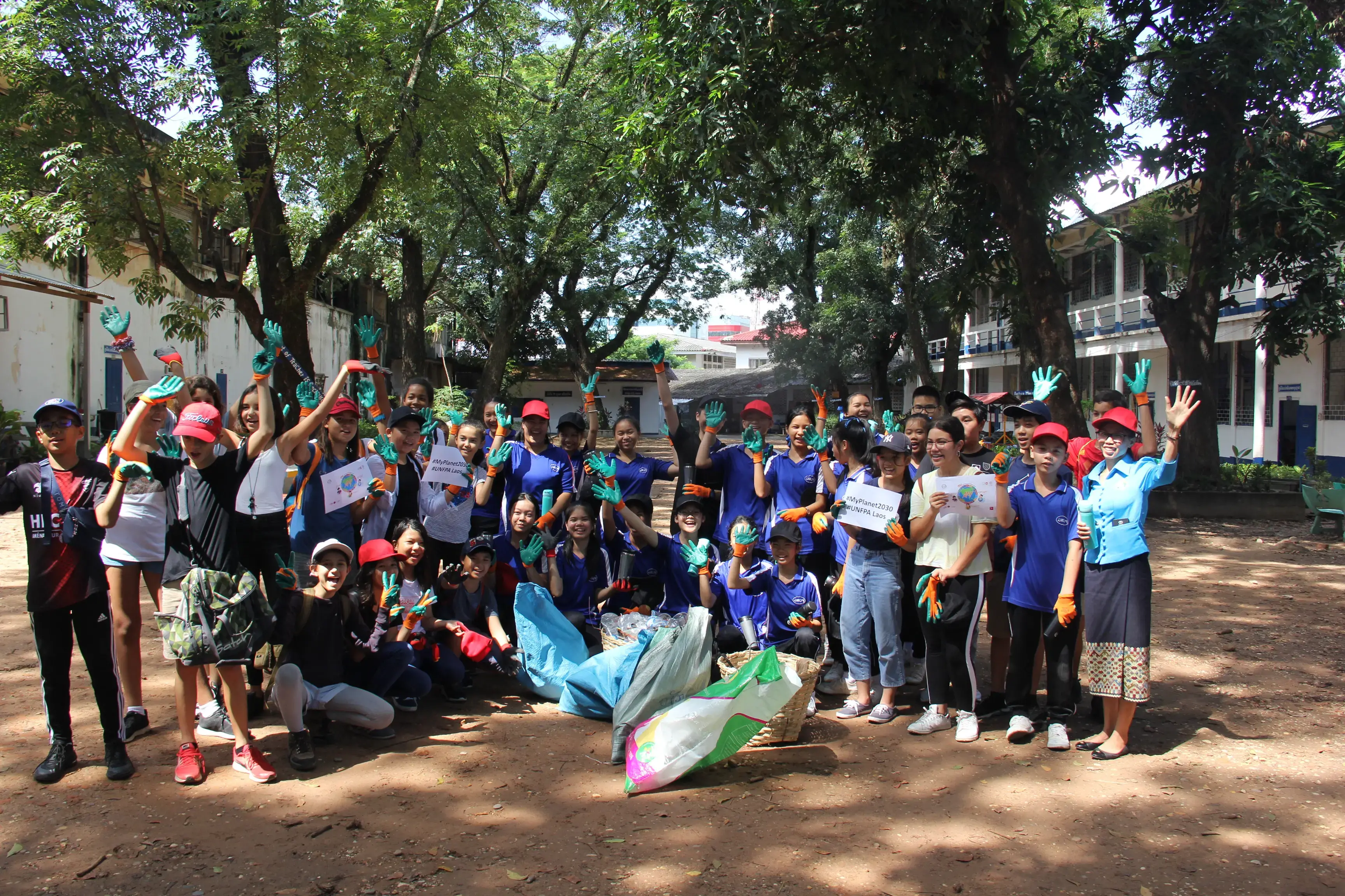 Lao youth take on the Me, My Body My Planet, My Future campaign prior to the International Day of the Girl Child