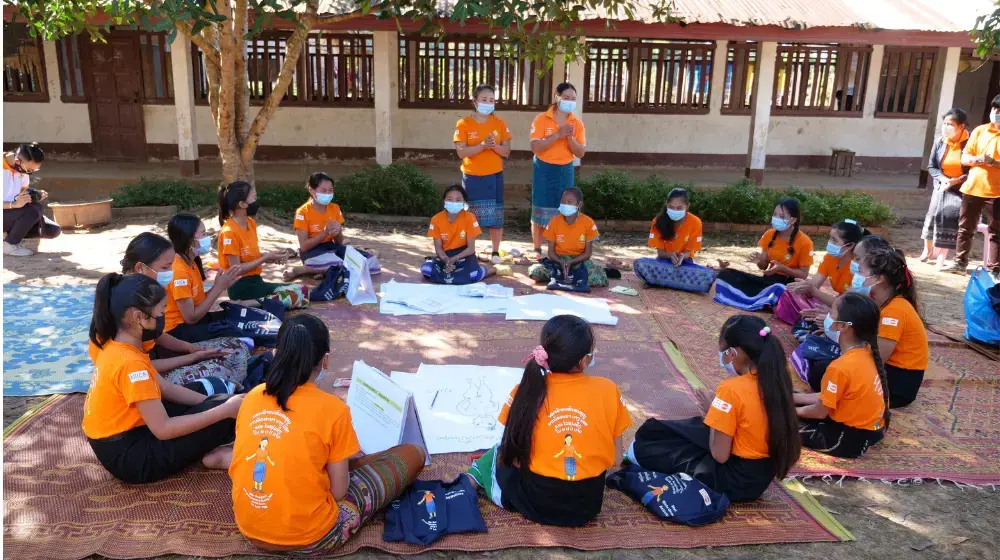 Village girls in orange shape their own futures